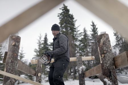 Joel Jacko builds a dock in the winter season. (National Geographic/Wayne Shockey)
