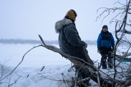 Chevie Roach teaches his son Ryder how to set marten traps along their trapline. (BBC Studios Reality Productions, LLC/Jayce Kolinski)