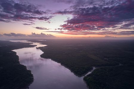 The sun rises near the mouth of the Amazon River. (credit: National Geographic/Pablo Albarenga)