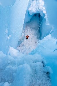 Hazel Findley at the bottom of a moulin. (photo credit: National Geographic/Matt Pycroft)