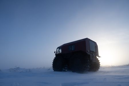 Sue Aikens in her all terrain vehicle, travels across the snowy tundra. (BBC Studios Reality Productions, LLC/Jayce Kolinski)