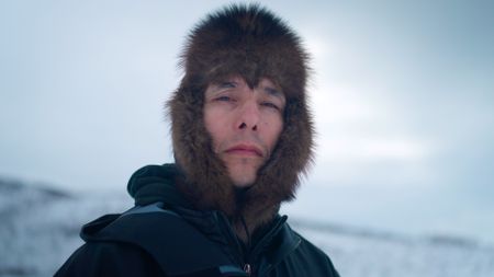 Ricko DeWilde in the Huslia wilderness in the winter season.(BBC Studios/Ryan Walsh)