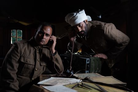 Captain Anis Khan and medic Siddiq Ahmed (played by Shammi Aulakh and Rishi Rian, respectively) are pictured in a scene of a WW2 reenactment production for "Erased: WW2's Heroes of Color."  Captain Anis Khan and medic Siddiq Ahmed were members of Force K6, a little-known Indian regiment of mule handlers in WW2. Amidst the chaos of Dunkirk and the advancing German Army, the Indian regiment fought for victory and independence. (National Geographic/Harriet Laws Herd)