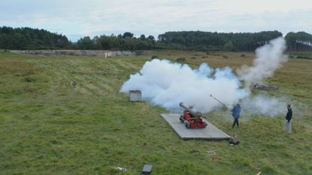 A Napoleonic era cannon replica is being fired. (National Geographic)