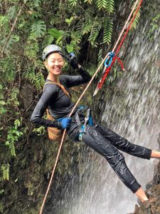 Chef Kristen Kish rappels down a waterfall to collect a type of fresh watercress which only grows in that particular location in Hacienda Mamecillo, Panama. (National Geographic for Disney/Missy Bania)