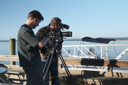 Director Martin Cass and director of photography Mark Romanov filming Gene Brooks on his dock at the Wilmington River. (National Geographic/Verity Thomson)