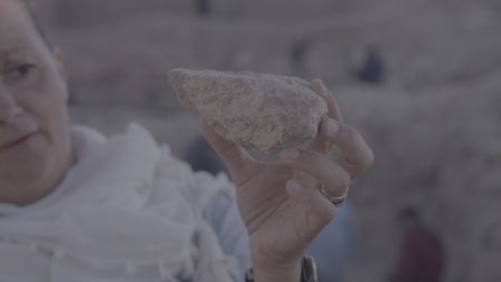 Lead archaeologist Katharina Schmidt presents a significant find at the active dig site. (Windfall Films/Alex Collinge)