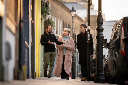 Thomas Haward, Florence Pugh and Antoni Porowski walk on Columbia Road. (National Geographic/Chris Raphael)