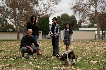 The Hernandez family with Lucy in the park. (National Geographic)