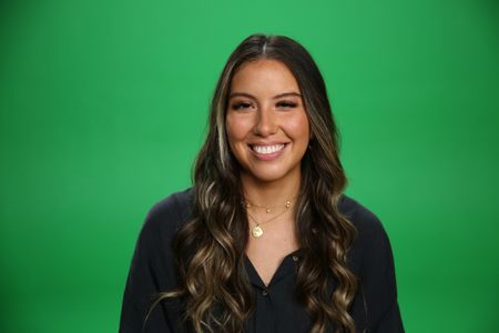 Heidy Martinez smiling Infront of greenscreen. (National Geographic/Robert Toth)