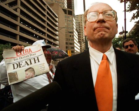 Defense attorney Stephen Jones holds a newspaper outside of the U.S. Courthouse in Denver, Colo. on June 13, 1997, after the jury sentenced Timothy McVeigh to death for the 1995 Oklahoma City bombing. (Susan Sterner/The Associated Press)