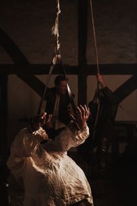 Dietrich Flade in the torture room, is hoisted up by the arms on the strappado torture device. (Dash Productions Services LTD/Antoan Ivanov)