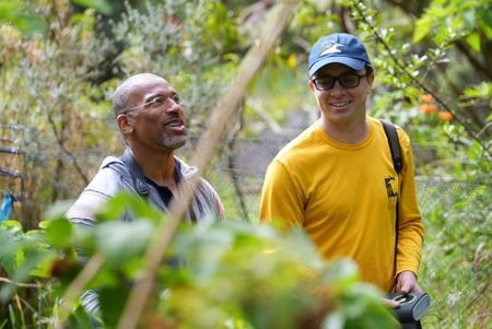 Christian Cooper and avian technician Bret Nainoa Mossman prepare to raise mistnets to catch Hawaiian forest birds at the Pu'u Maka'ala Natural Area Reserve. (National Geographic for Disney/Troy Christopher)