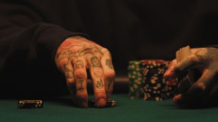 Mikki Mase plays his chips on the table. (National Geographic)