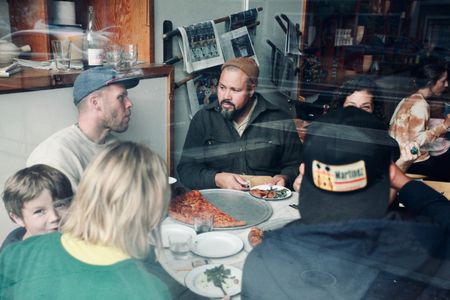 Josey Baker connects with fellow baker Z Anderson at The Mill's weekly pizza party in San Francisco. (National Geographic/Ryan Rothmaier)