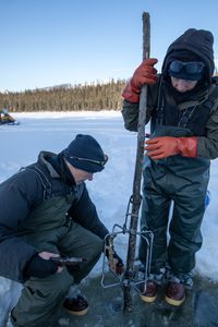 Andy Bassich and Denise Becker set beaver traps in the winter season when their fur is prime. (BBC Studios Reality Production/Ben Mullin)