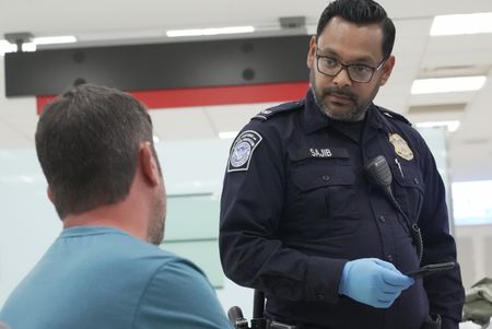 CBP Officer Dunlap questions a traveler after they exhibited strange behavior at the Philadelphia International Airport in Philadelphia, Pa.  (National Geographic)