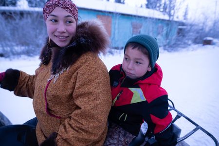 Wade Kelly with his mother, Iriqtaq Hailstone, heading to an elder's home to give away his first ptarmigan. (BBC Studios Reality Productions, LLC/Ashton Hurlburt)