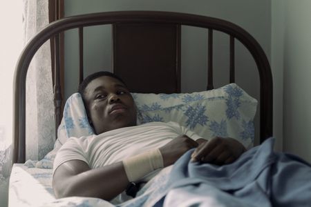 A teen Martin Luther King Jr., played by Jalyn Hall, recovers in bed as seen in GENIUS: MLK/X. (National Geographic/Richard DuCree)