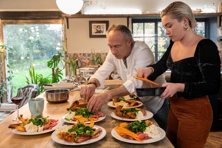 Clinton Pugh and Florence Pugh plate up the roast dinners. (National Geographic/Chris Raphael)