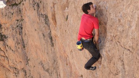 Alex Honnold free solos Les Rivieres Pourpres.  (photo credit: National Geographic)