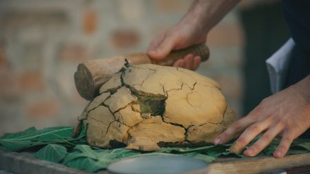 Guinea fowl is hit with a mallet before serving at Locanda del Falco. (National Geographic)