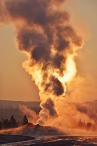 Old Faithful Geyser steaming at sunrise in Yellowstone National Park. (Getty Images/Westend61)