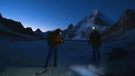 The sun is about to rise as David Lama (left) and Conrad Anker are ready to start their ascent of Lunag Ri, in the Himalayas.  (Mandatory credit: Red Bull Media House)