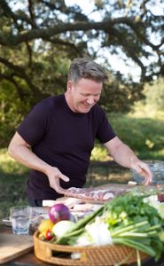 TX - Gordon Ramsay prepares ribs during the final cook in Texas. (Credit: National Geographic/Justin Mandel)