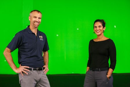 Diva Amon and Mike Heithaus in front of the green screen at the studio lab shoot. (National Geographic/Aubrey Fagon)