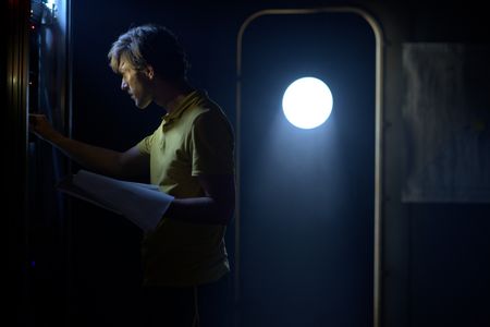 A dramatic reconstruction for "Cursed Gold: A Shipwreck Scandal" shows a crew member in the ship's Control Room. In 1989, maverick scientist Tommy Thompson stuns the world by recovering three tons of gold from a shipwreck deep in the Atlantic Ocean. What follows is a 30-year story of adventure, deception, and personal turmoil, taking him from venerated celebrity to infamous fugitive, and finally a defiant prisoner who refuses to give up his gold. (National Geographic)