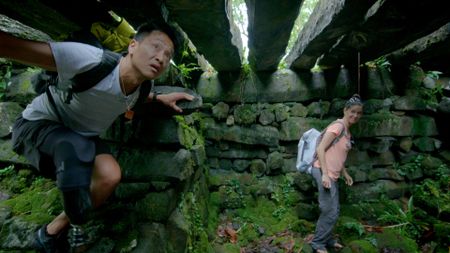 Albert Lin and Ashley Meredith inside a tomb. (National Geographic/Pete Allibone)