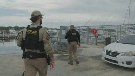 CBP AMO Agents walk towards the dock on their way to conduct their search in Mayag¸ez, P.R.. (Lucky 8 TV/Paul Taggart)