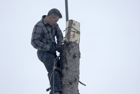 Joel Jacko installs a windmill on his property for additional power. (National Geographic/Wayne Shockey)