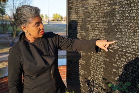 Oklahoma State Representative Regina Goodwin visits the Black Wall Street Memorial in Tulsa, OK. (National Geographic/Christopher Creese)