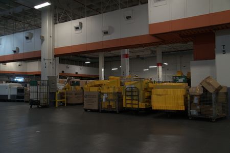 Multiple shipped boxes await organzation or inspection in the JFK Mail Facility at the JFK International Airport, in New York. (National Geographic)