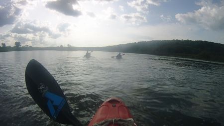 Chris Korbulic, Hendri Coetzee, and Ben Stookesberry kayak down a calm section of river.  (mandatory photo credit: Benjamin Stookesberry)