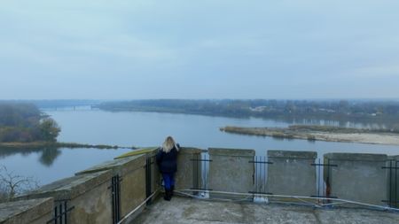 Alina looking into distance over river. (National Geographic)