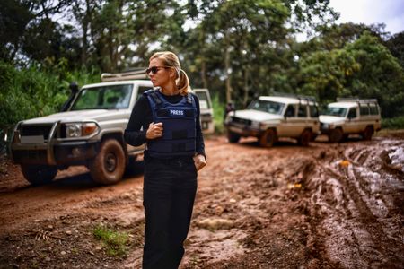 Mariana van Zeller waits as the team tries to clear a vehicle from the deep mud in the Congolese forest. (National Geographic for Disney)