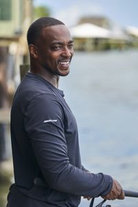 Anthony Mackie fishing off a dock in Slidell, Louisiana. He is aiming to catch a baby Bull Shark in Lake Pontchartrain. (National Geographic/Brian Roedel)