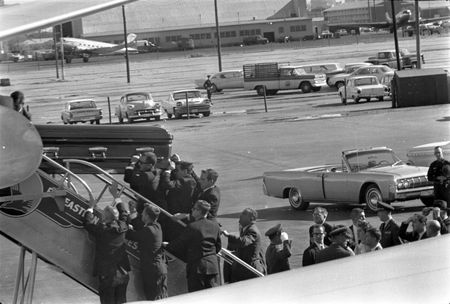 President John F. Kennedy's casket is carried onto Air Force One at Love Field in Dallas, Nov. 22, 1963. Onlookers include Lawrence O'Brien, General Clifton, Jacqueline Kennedy, Kenneth O'Donnell, Dave Powers, and Evelyn Lincoln. (Cecil Stoughton/White House Photographs/John F. Kennedy Presidential Library and Museum, Boston)