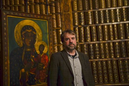 Tony Pollard in the library at Jasna Gora Monastery, Poland. In 1655 the monastery defended itself against an onslaught from the Swedish army. (National Geographic/Ciaran Henry)