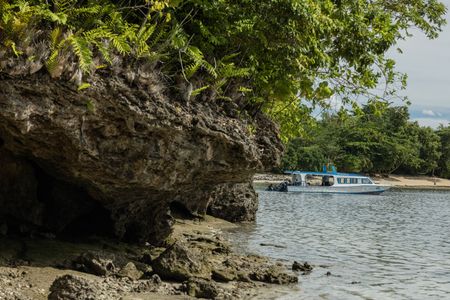 Dive vessel 'Siladen 16' moored near the shore line in Bunaken Marine Park, home to the Algae octopus (Abdopus aculeatus).  (photo credit: National Geographic/Harriet Spark)