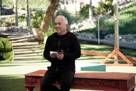 Cesar Millan reading a card from Roman. (National Geographic)