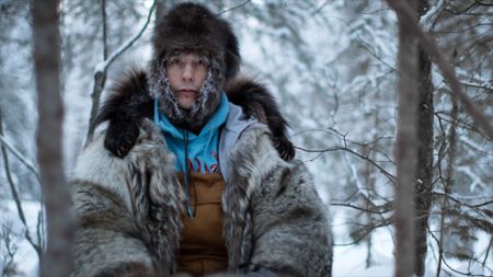 Ricko DeWilde searches for places to set wolf snares to help protect the caribou and moose population in his area. (BBC Studios/Ryan Walsh)