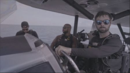 Multiple CBP AMO agents, including Agent Alex, ride on an official vessel while scoping out the surrounding water in Fajardo, P.R.  (Lucky 8 TVIvan Leon)