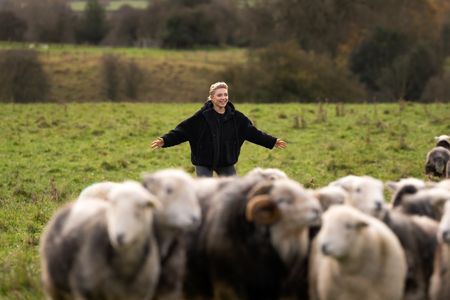 Florence Pugh attempts to herd sheep in Yorkshire. (National Geographic/Chris Raphael)