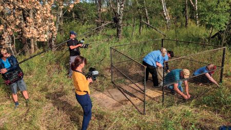 A TV crew shooting the Badger Cage construction. (Staying Wild Productions Inc.)