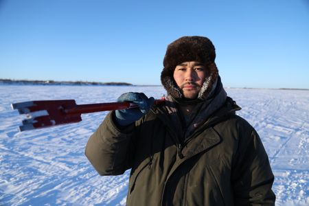 Avery Hoffman setting fish nets under the ice with his brother for subsistence food during the winter season. (BBC Studios Reality Productions, LLC/Isaiah Branch - Boyle)