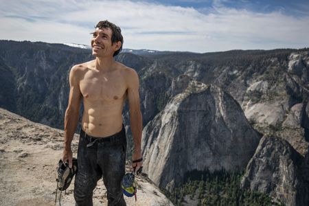 Alex Honnold holds all of his climbing gear atop the summit of El Capitan. He just became the first person to climb El Capitan without a rope. (National Geographic/Jimmy Chin)
